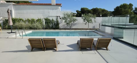 Property building, Patio, Swimming pool, sunbed
