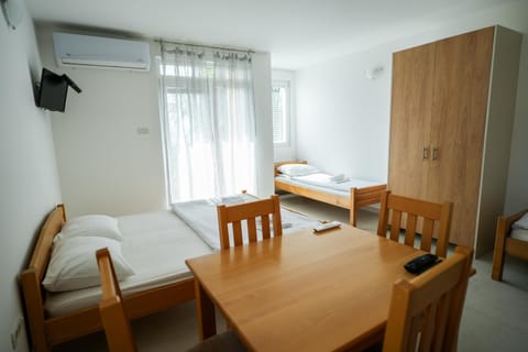 Bed, Seating area, Dining area, Bedroom, towels, wardrobe, air conditioner