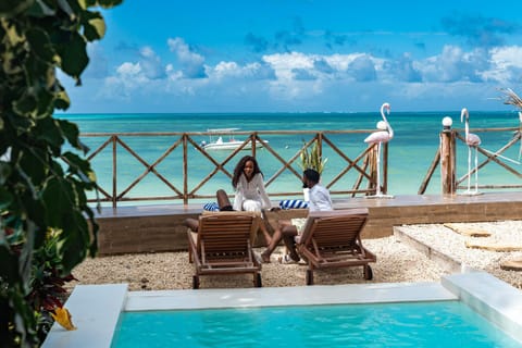 People, View (from property/room), Balcony/Terrace, Pool view, Sea view, Swimming pool, group of guests