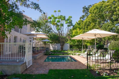 Property building, Patio, Garden, Garden view, Swimming pool, sunbed