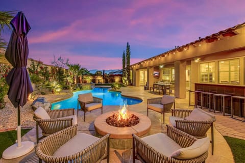 Property building, Patio, Night, Natural landscape, Seating area, Swimming pool