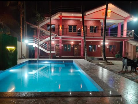 Property building, Night, Pool view, Swimming pool, Swimming pool, sunbed