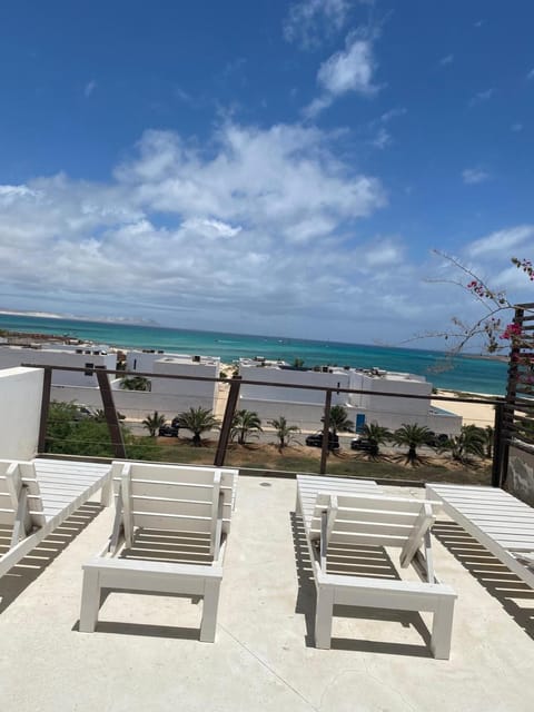 Patio, Natural landscape, View (from property/room), Balcony/Terrace, Seating area, Beach, Sea view, sunbed