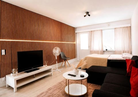 Bed, TV and multimedia, Living room, Seating area, Evening entertainment