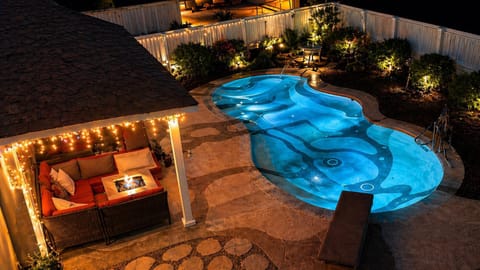 Property building, Patio, Night, Natural landscape, Pool view, Swimming pool