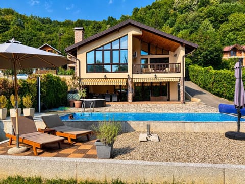 Property building, Patio, Natural landscape, Pool view, Swimming pool, sunbed