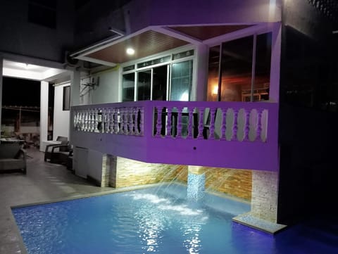 Property building, Patio, Night, Pool view, Swimming pool, sunbed