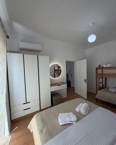 Bed, Bedroom, bunk bed, towels, wardrobe, air conditioner
