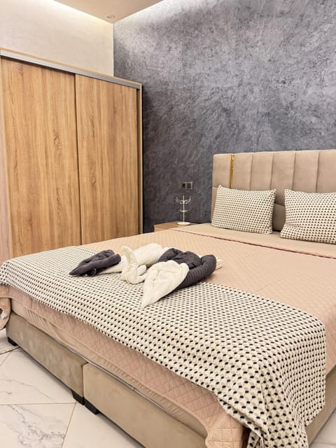 Bed, towels, wardrobe