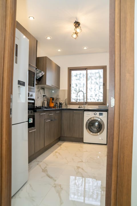 Kitchen or kitchenette, oven, stove, washing machine