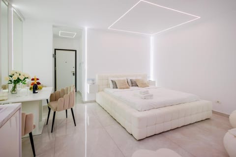 Bed, Living room, Photo of the whole room, Seating area, Bedroom, towels, wardrobe, air conditioner