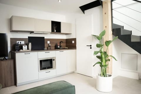 Kitchen or kitchenette, microwave, oven, stove, toaster