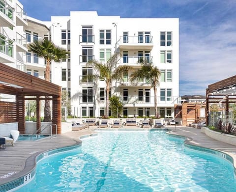 Property building, Patio, Pool view, Swimming pool, sunbed