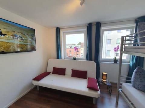 Bed, TV and multimedia, Seating area, Bedroom, bunk bed, towels, wardrobe