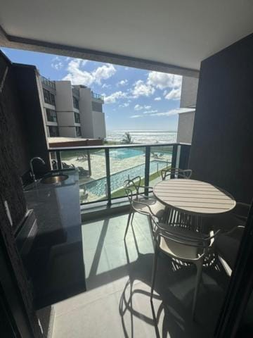 Property building, Natural landscape, View (from property/room), Balcony/Terrace, Dining area, Pool view, Sea view