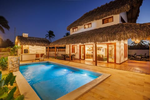 Property building, Patio, Night, BBQ facilities, BBQ facilities, Pool view, Swimming pool, sunbed