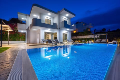 Property building, Patio, Night, Pool view, Swimming pool, sunbed