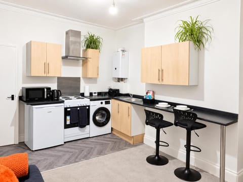 Kitchen or kitchenette, Dining area, oven, stove, toaster, washing machine