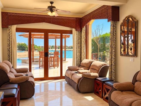 Patio, Natural landscape, View (from property/room), Balcony/Terrace, Living room, Seating area, Lake view, Sea view