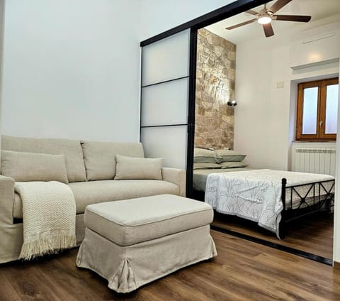 Bed, Living room, Seating area, Bedroom