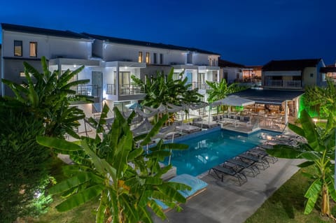 Property building, Patio, Night, Natural landscape, Pool view, Swimming pool, sunbed