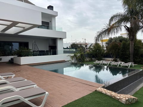 Property building, Living room, Swimming pool