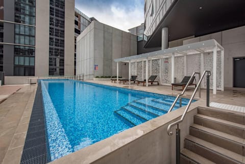 Property building, Day, Pool view, Swimming pool, sunbed