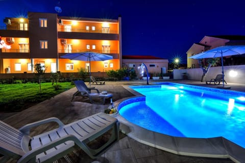 Property building, Night, Swimming pool