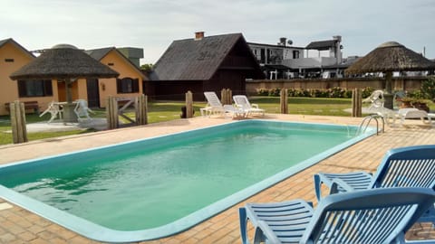 Property building, Pool view, Swimming pool, sunbed