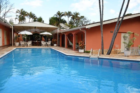 Property building, Patio, Day, Pool view, Swimming pool, sunbed