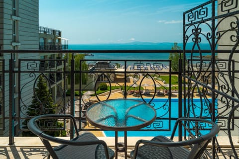 Property building, Patio, Day, View (from property/room), Balcony/Terrace, Photo of the whole room, Pool view, Sea view, Swimming pool, sunbed