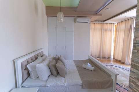 Bed, Bedroom, towels, wardrobe, air conditioner