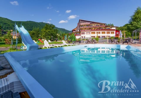 Property building, Facade/entrance, Day, Natural landscape, Beach, Mountain view, Pool view, Swimming pool, sunbed