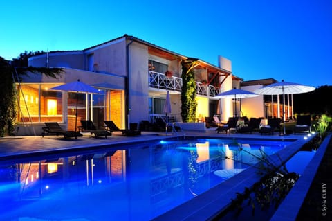 Property building, Patio, Night, Swimming pool, Swimming pool