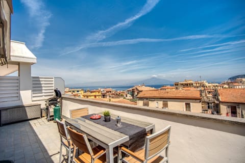 Property building, Patio, Day, View (from property/room), Balcony/Terrace, Dining area, City view, Mountain view, Sea view