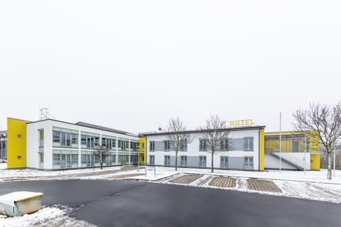 Property building, Facade/entrance, Day, Property logo or sign, Winter