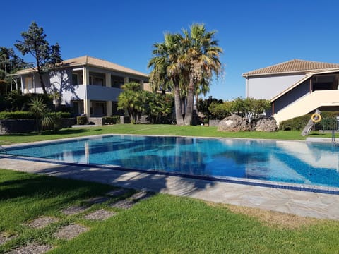 Property building, Day, Natural landscape, Garden, Garden view, Pool view, Swimming pool