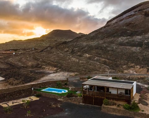 Property building, Nearby landmark, Natural landscape, Bird's eye view, Mountain view, Swimming pool, Sunset