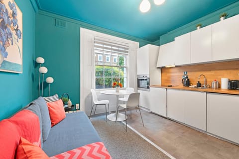 Photo of the whole room, Seating area, microwave, oven, kitchen