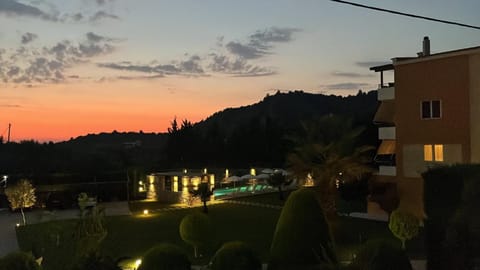 Property building, Garden view, Garden view, Swimming pool, Sunset