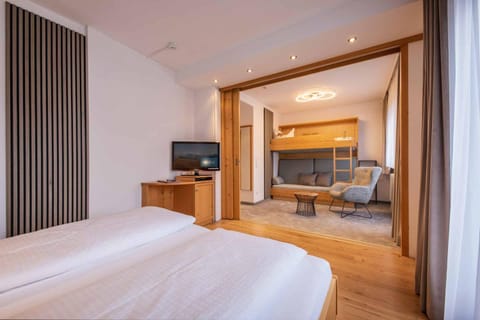 Bed, TV and multimedia, Seating area, Bedroom, hair dresser