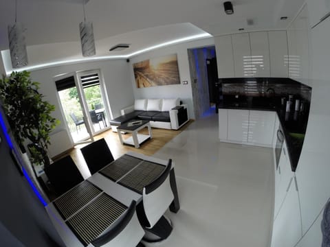 Property building, Communal lounge/ TV room, Bed, Balcony/Terrace, Living room, Dining area, Beach, Communal kitchen