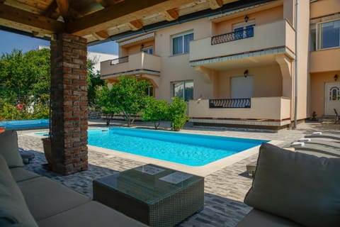 Property building, Seating area, Swimming pool