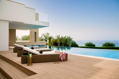 Property building, Patio, Day, Natural landscape, View (from property/room), Balcony/Terrace, Living room, Seating area, Pool view, Sea view, Swimming pool, sunbed