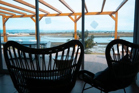 Property building, Communal lounge/ TV room, Natural landscape, Balcony/Terrace, Living room, Seating area, Dining area, River view, Sea view