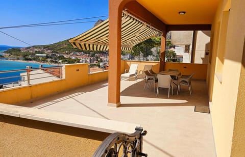 Property building, Patio, Facade/entrance, Day, View (from property/room), Balcony/Terrace, Seating area, Mountain view, River view, Sea view, Street view