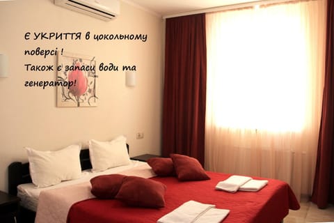 Bed, Photo of the whole room, Text overlay