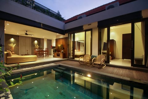 Property building, Night, Living room, Seating area, Swimming pool