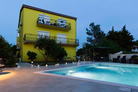 Property building, Swimming pool, Sunset
