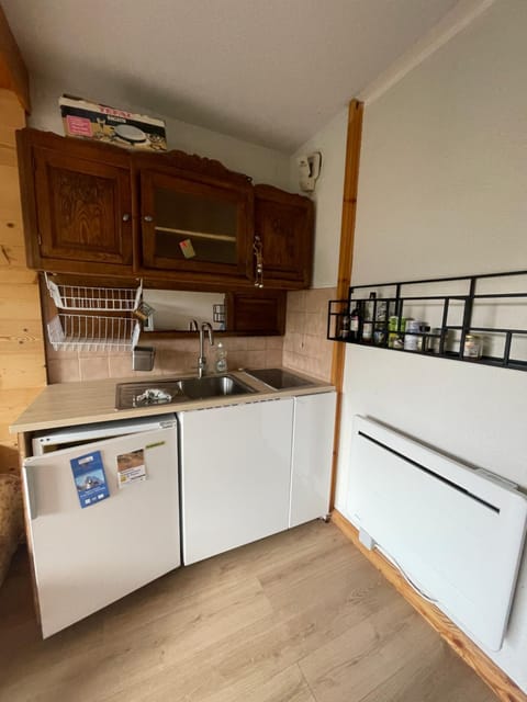 Kitchen or kitchenette, storage, stove